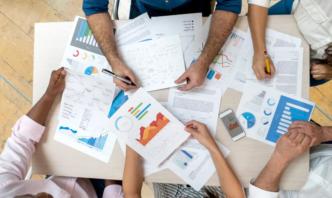 People working with data and graphs