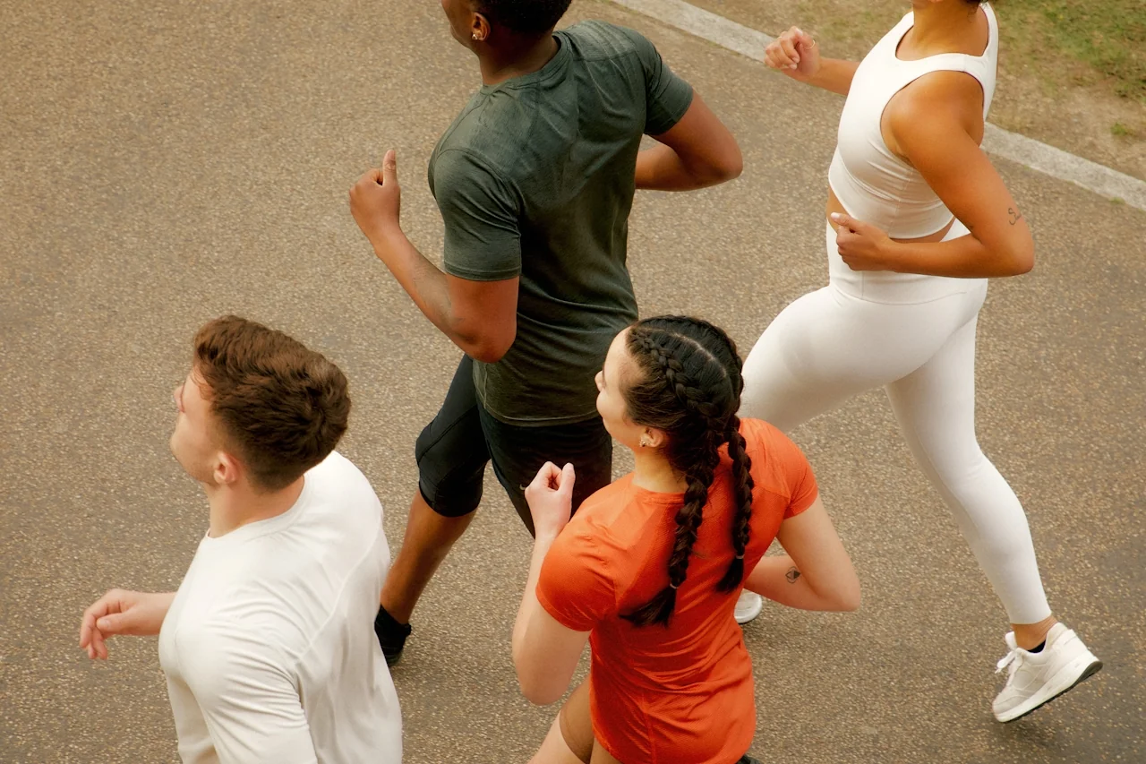 Four runners in workout clothes