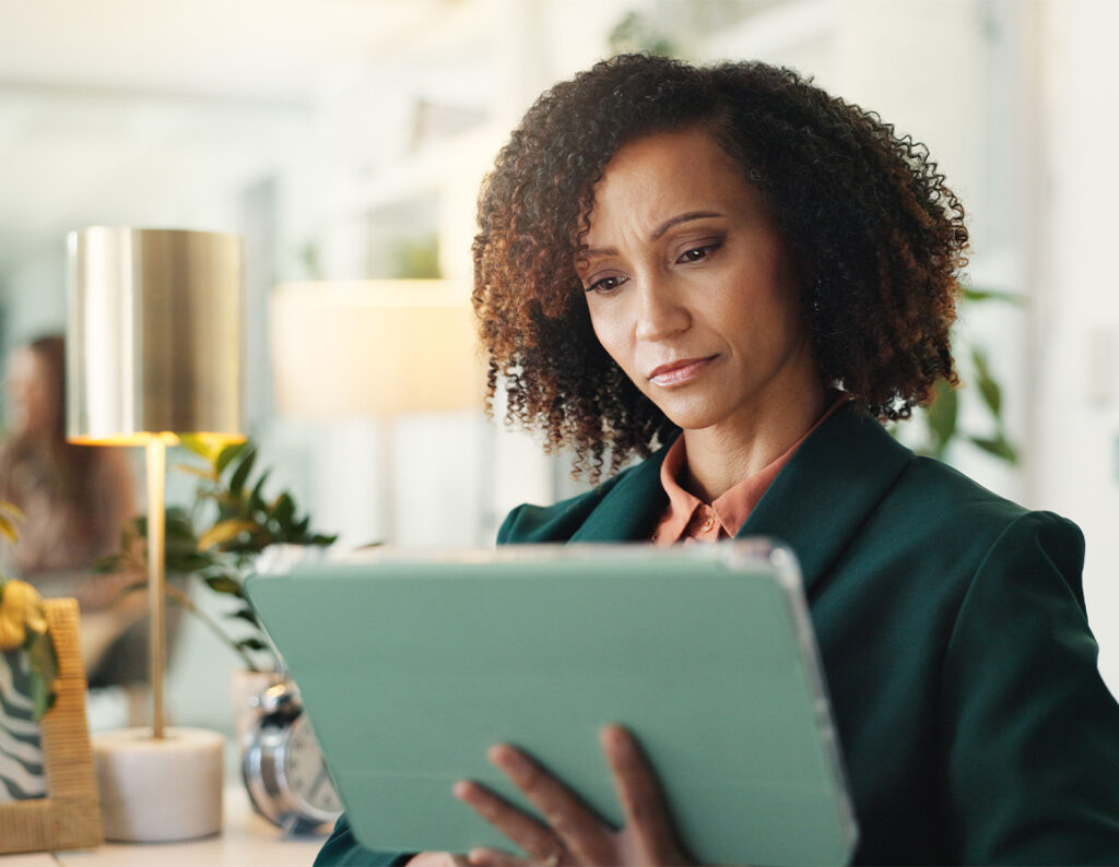 Woman looking at iPad in an office setting