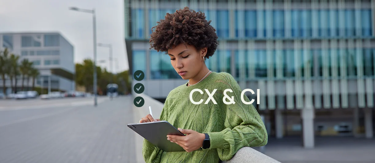 Woman holding iPad outside office building. 3 checkmark icons appear above with the text CX & CI.