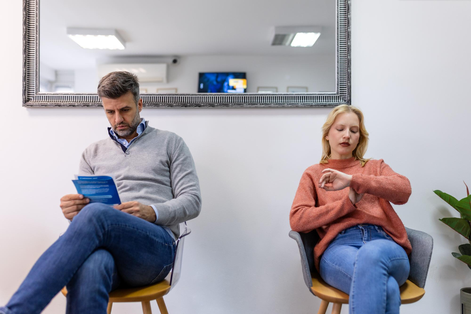 Patients waiting in a healthcare clinic, illustrating how wait times and the overall patient experience influence provider loyalty.
