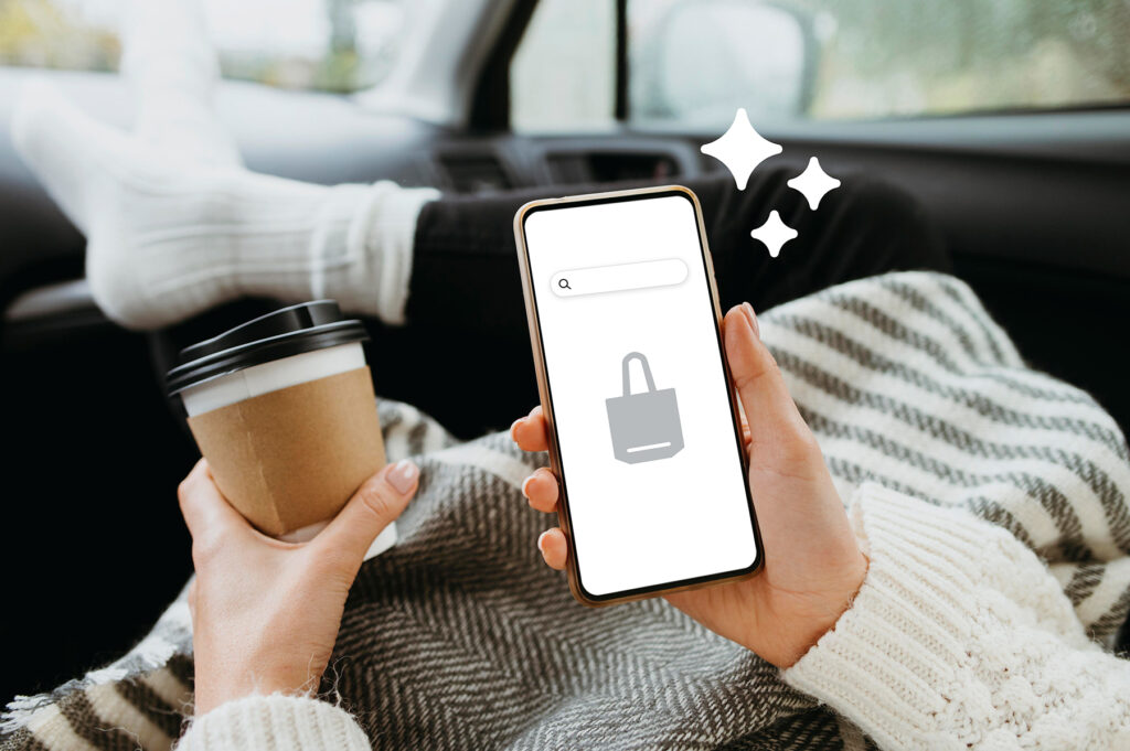 Person relaxing in a car while shopping on a smartphone, holding a coffee cup and searching online using AI search.