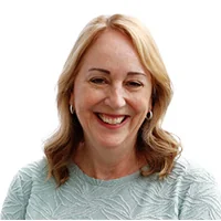 Professional headshot of a smiling woman